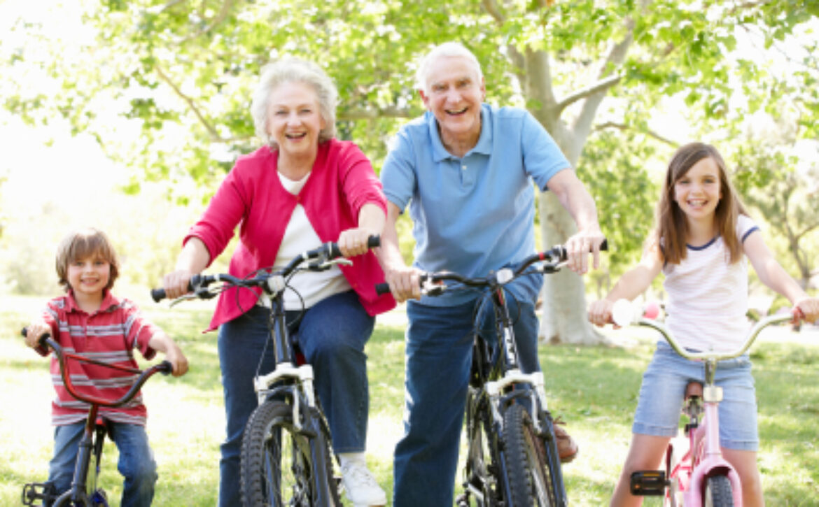 Senior couple with grandchildren on bikes