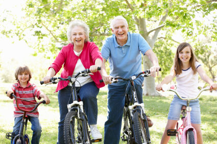 Senior couple with grandchildren on bikes