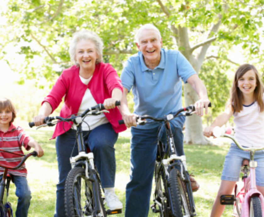 Senior couple with grandchildren on bikes